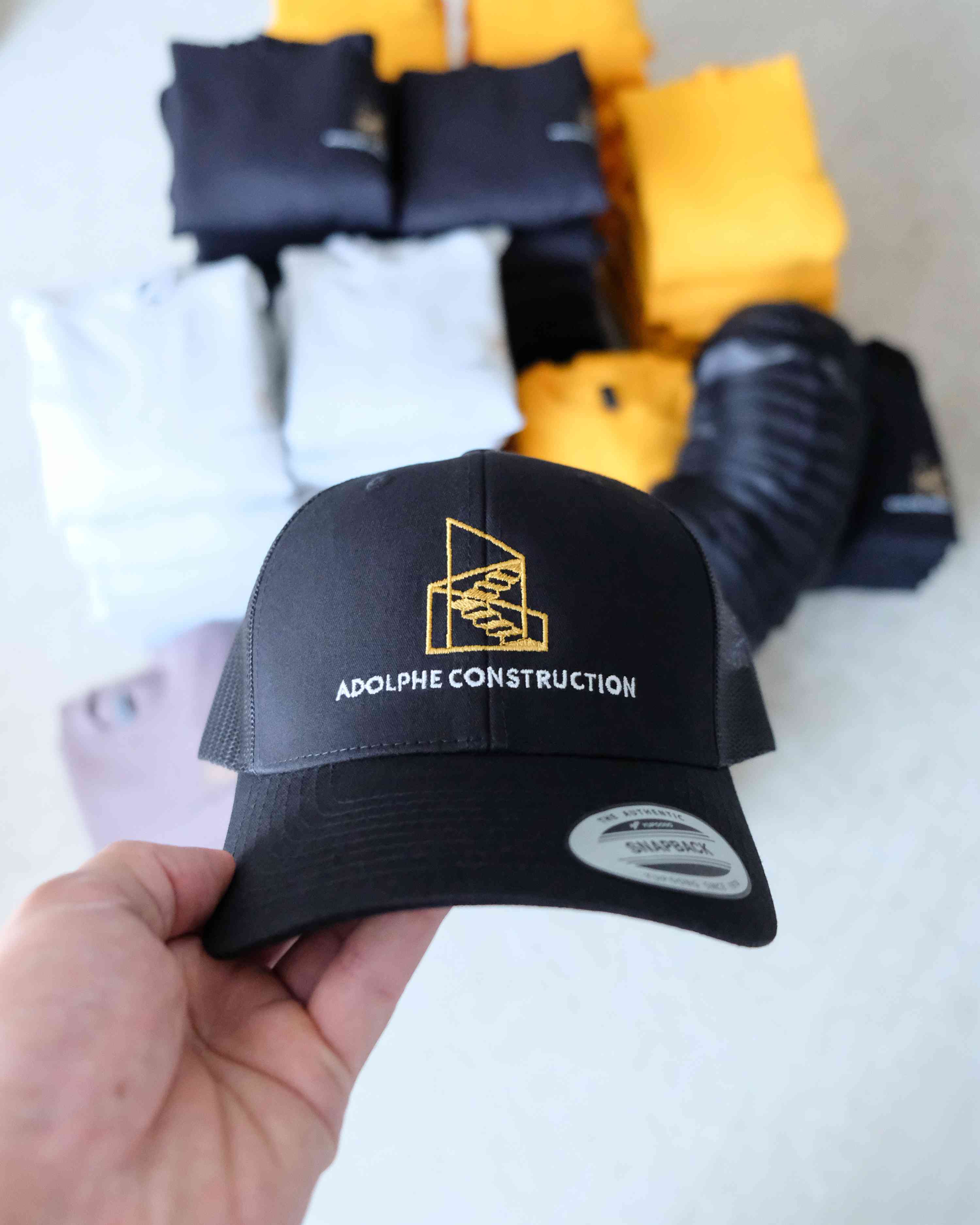Adolphe Construction — Vêtements de travail personnalisés pour une entreprise de construction.